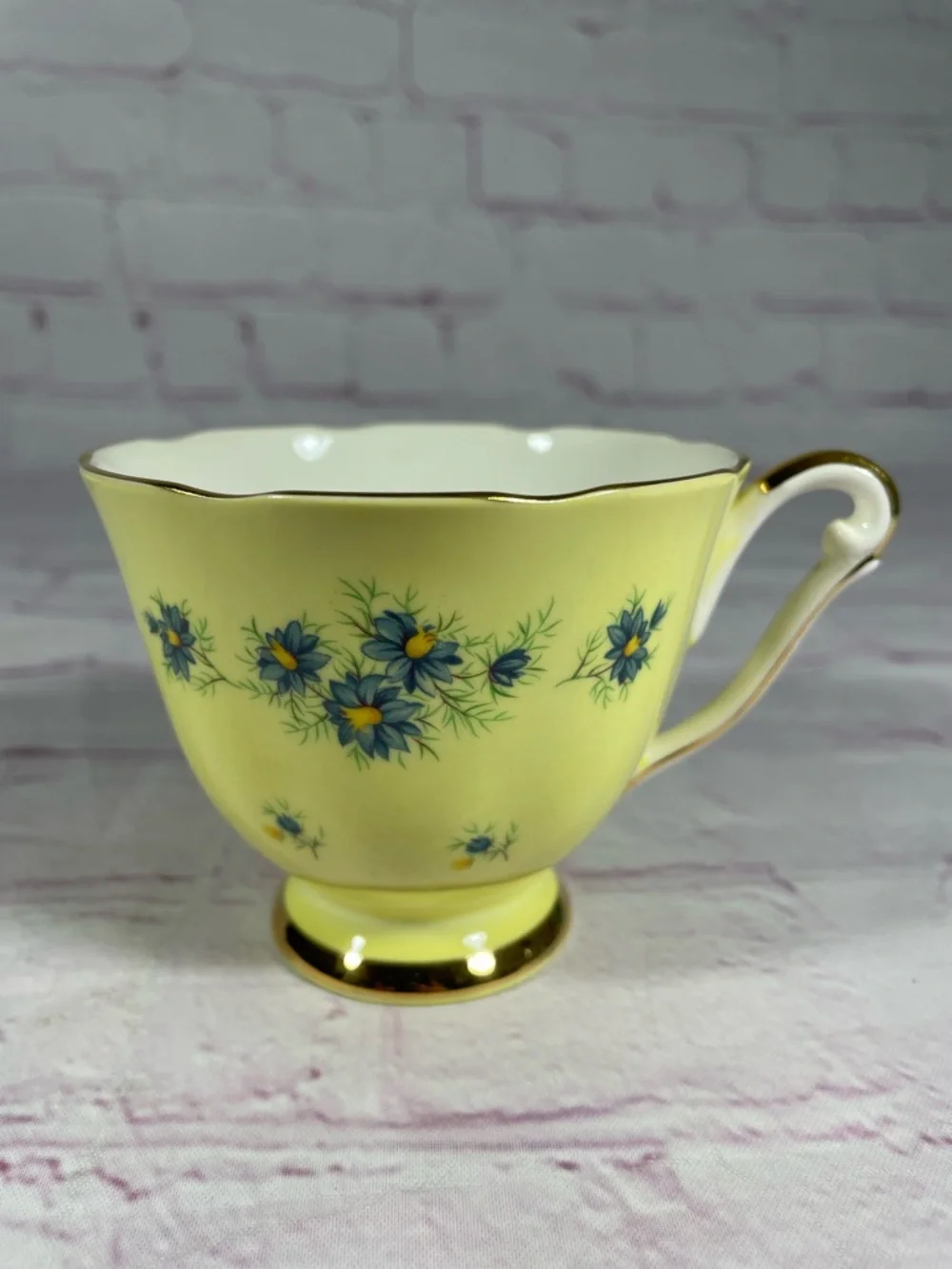 Vintage Yellow and Blue Floral Gold Trim Bone China Footed Teacup and Saucer Set